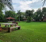 Verified plot for sale in Manesar with boundary fencing and clear demarcation