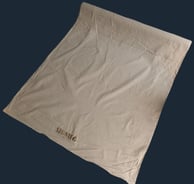 Lipatan kain kanvas katun SIGNIFO yang lembut dan natural.