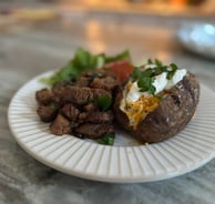 steak bites and baked potatoes