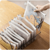a person holding a piece of paper with a picture of a cookie cutter