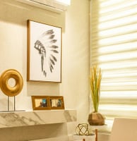 a living room with a clock and a clim on the wall