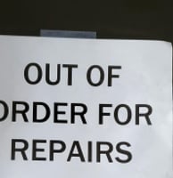 a sign that says out of order for repairs