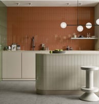 a kitchen with a counter top and a bar stool