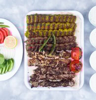 a plate of meat and vegetables on a table