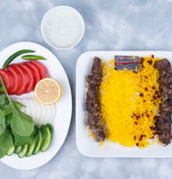 a plate of food with a fork and a knife on a table