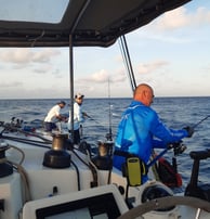 Anglers jigging on a catamaran - Catamaran Fishing Charters Seychelles