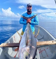 Angler proudly displaying a Yellowfin Tuna caught on a Full-Day Fishing Charter in Zanzibar