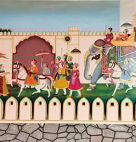 A colorful mural showcasing Indian individuals in traditional attire, enhancing the ambiance of the room