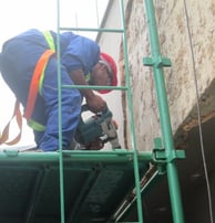 Mechanical stripping of compromised exterior plaster for waterproofing works, Sandhurst Towers, Sandton