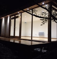 night image of a garden room with spotlights