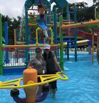 2 women inspectors in a kids splash pool