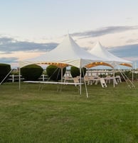 20x49 white tent, outdoor event, tables, chairs