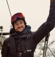 A mountain guide on a boat smiling | ski and sail in Norway
