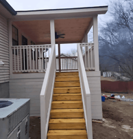 a house with a staircase deck porch nashville