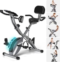 a woman is sitting on a stationary bike