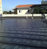 a man standing on a roof top with a lot of numbers on it