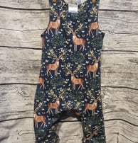a baby's romper with a deer print