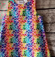 a colourful rainbow heart print dress for children