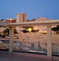 a view of a city with a clock tower in the background