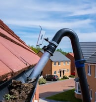 leaves being vacuumed out of a guttering in droitwich