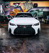Lexus IS 350 getting Maxxis tyres installed at a professional tire shop in Lagos
