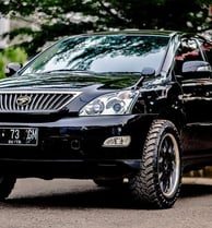 Lexus RX 330 parked at Tyrepublic’s Lagos tyre shop with Bridgestone tyres installed