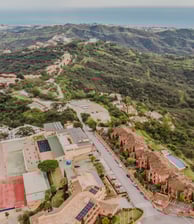 a large building with a tennis court and a tennis court