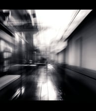 a blurry photo of a clock tower in a city