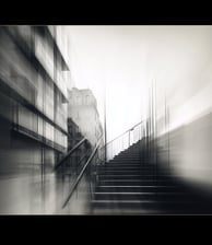 a person walking up stairs with a skateboard