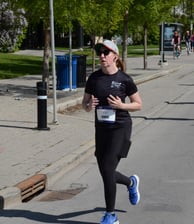 Photo of Karas Wright running during Calgary 1/2 marathon