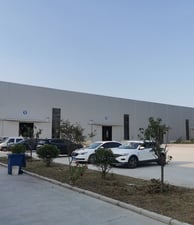 View our Zorylift loader crane plant: a large production facility with dedicated loading bays for seamless global shipping.