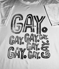 knot straight shirt in black and white says GAY. several times in different directions.