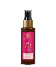 a bottle of rose water toner with a pink rose on it