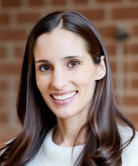 a woman with long hair and a white sweater