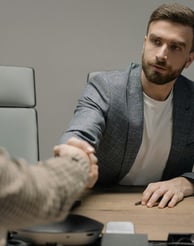 People are talking and shaking hands