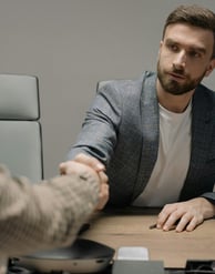 People are talking and shaking hands