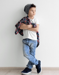 boy wearing white t-shirt, jeans, and beanie
