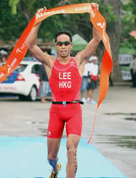 Photo of Daniel Lee, Hong Kong triathlete, crossing the finish line at the Bali 2008 triathlon