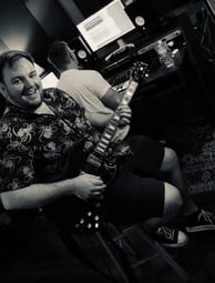 black and white image of john smiling