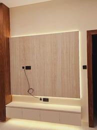 a room with a tv and a wall mounted with a tv