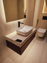 a bathroom with a sink and a phone