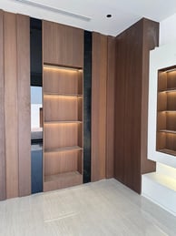 a room with a bookcase and a book shelf