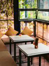 a table with two tables and a window