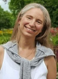 a woman in a white tank top and a gray scarf cecilia aylion