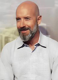 a bald balding man with a beard and a white shirt martin pe coach