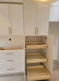a kitchen with a pantry from kitchenrta with white cabinets and drawers
