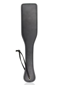 a faux leather paddle for bdsm play