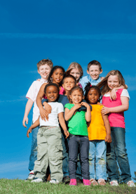 Colorful group of children on a hilltop