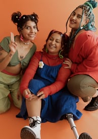 Young female friends supporting their friend who has a leg amputation