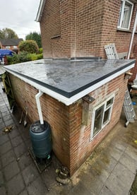 Finished garage roof renovation from back
